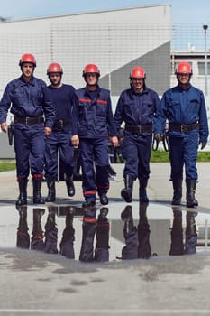 A team of confident and accomplished firefighters strides purposefully in their uniforms, exuding pride and satisfaction after successfully completing a challenging firefighting mission.