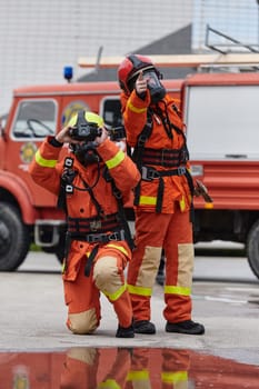 A group of firefighters undergoes training to learn how to effectively use a thermal camera in firefighting operations.