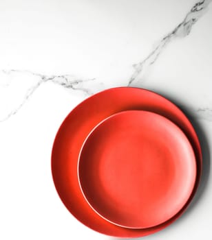 empty red plate on marble - recipe and restaurant mockup flatlay styled concept