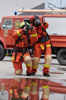 A group of firefighters undergoes training to learn how to effectively use a thermal camera in firefighting operations.