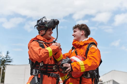 A unified team of firefighters, adorned in their uniforms, engages in a heartfelt celebration marked by triumphant salutes and cheers, embodying the joy and gratitude following the successful completion of a challenging firefighting mission.