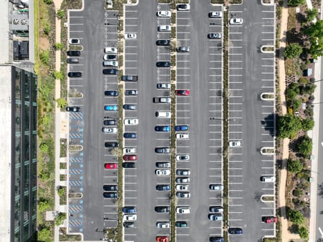 Open car parking lot viewed from above, aerial top view