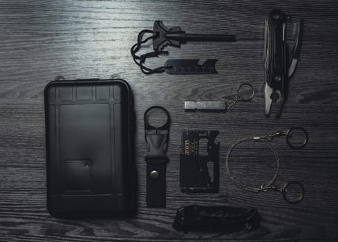 Wild Survival Kit. Items on a wooden table. Gloomy photo. High quality photo