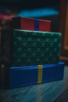 Boxes with gifts on a wooden table. High quality photo