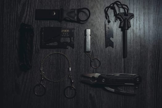 Wild Survival Kit. Items on a wooden table. Gloomy photo. High quality photo