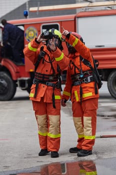 A group of firefighters undergoes training to learn how to effectively use a thermal camera in firefighting operations.