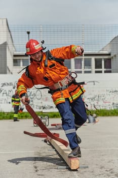 A firefighter, clad in professional gear, undergoes rigorous training to prepare for the hazards awaiting him on duty