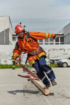 A firefighter, clad in professional gear, undergoes rigorous training to prepare for the hazards awaiting him on duty