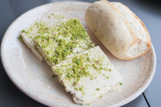 A closeup image showcasing the appealing pistachio halva slices, emphasizing their texture and vivid colors