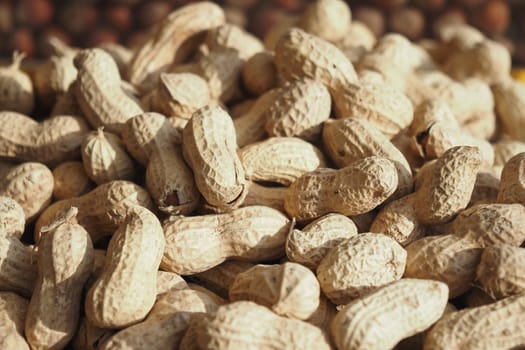 top view of Several peanuts in a basket..