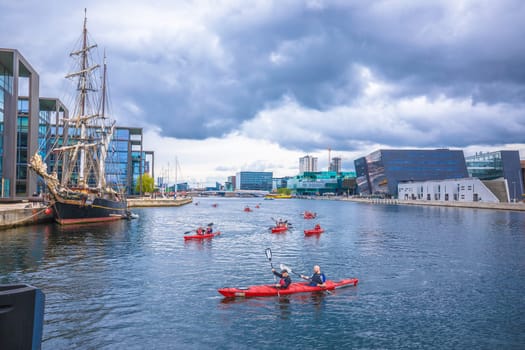 Copenhagen, Denmark, August 29 2023: People kayaking in canal in Copenhagen, capital of Denmark. Water recreation is famous activity in Scandinavian city.