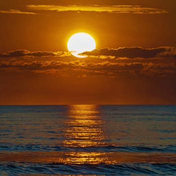 Hot summer sun over the sea. Sunset. High quality photo. Sunset over the water. Dawn. Sun over the ocean. Beach. Summer vacation