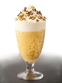 Toblerone milkshake Swiss glass Toblerone pieces honey nougat almond bits. Drink isolated on transparent background.