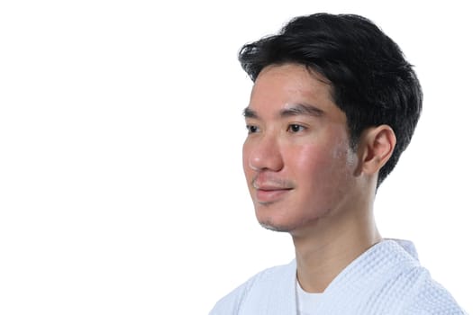 Headshot of attractive man after laser treatment over white background.