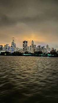 Chicago, Illinois, USA-november 7, 2023-An enchanting night-time vista of downtown Chicago as seen from the tranquil waters of the lake.