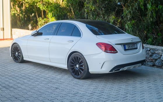 Gaziveren Cyprus 05.28.2024 - white Mercedes Bens in the parking lot 1