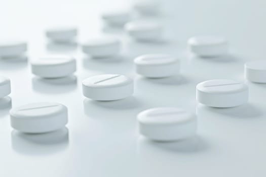 Closeup of white medication pills on table with reflection in background medical health concept photo