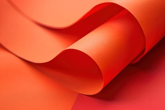 Curved edge orange paper displayed on top of patterned sheet, business meeting notes concept