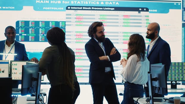 Staff members from a business enterprise discussing details and progress in a new project during a corporate meeting. Company experts getting informed about marketing developments. Camera A.