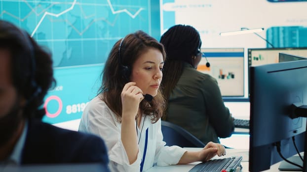 Business operators discussing with shareholders about key performance indicators, communicating heir organizational progress in order to expand the company internationally. Camera A.