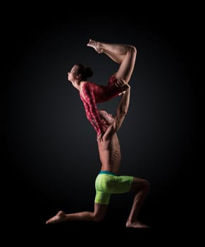 Image of young athletes perform acrobatic support