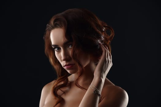 Studio portrait of beautiful sad woman posing nude