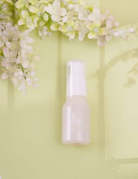 Unlabeled bottle of cosmetic or soap shower gel is displayed on an artistic background, product enclosure for liquid product for promotional and marketing purpose