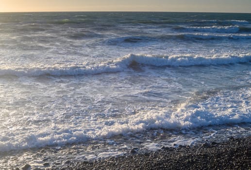 sea ​​foam on the waves of the Mediterranean sea on a summer evening 1