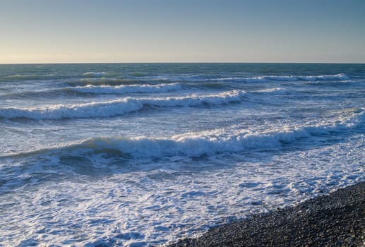 sea ​​foam on the waves of the Mediterranean sea on a summer evening 3