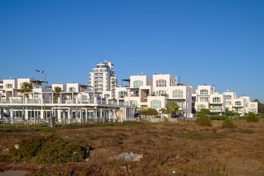 White houses on the sea in a village