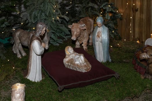 Christmas figurines in a creche with Joseph Mary and small Jesus