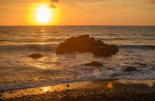 Beach stones in the background of the sunset in the Mediterranean Sea 2