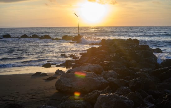 Sea landscape, sand beach and rocks on foreground. 2