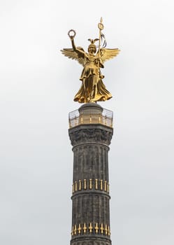 Berlin, Germany - Dec 20, 2023 - Upper part of The victory column with Goddess Victoria to Celebrate Prussia's victory in the Franco-German War in the Tiergarten, One of the most important sights of Berlin and one of the most important national monuments of Germany, Space for text, Selective focus.