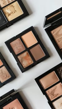 A flat lay showcasing various contouring palettes and highlighters, arranged on a light background.