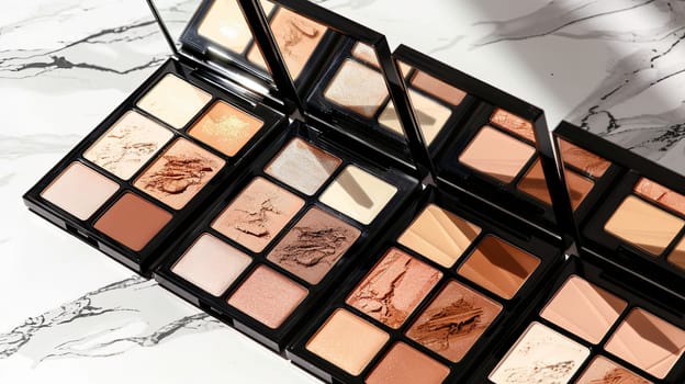 A close-up of multiple contouring palettes and highlighters with rich colors and elegant design.