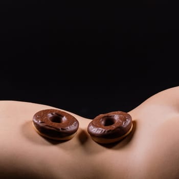 Close up young nice lady woman with slim body perfect skin nude top lingerie stand hold donut