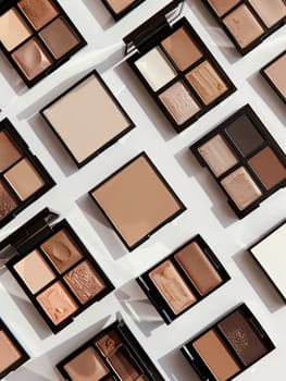 A variety of contouring and highlighting palettes with rich colors arranged on a light background.