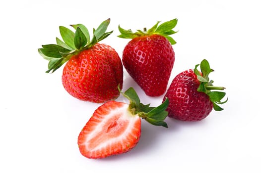 Overhead view of strawberries over white background