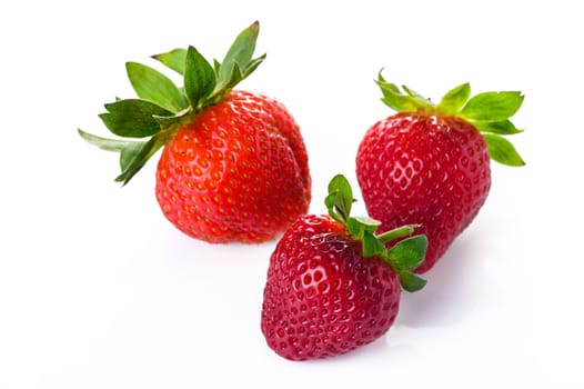 Set of ripe strawberries. Whole and cut berries isolated on white background.