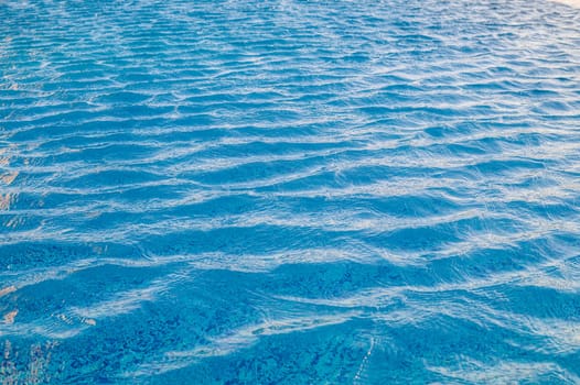 Beautiful sun reflections of water in the pool. Summer. Flight holidays. 2