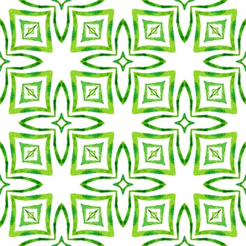 Textile ready fascinating print, swimwear fabric, wallpaper, wrapping. Green divine boho chic summer design. Ikat repeating swimwear design. Watercolor ikat repeating tile border.