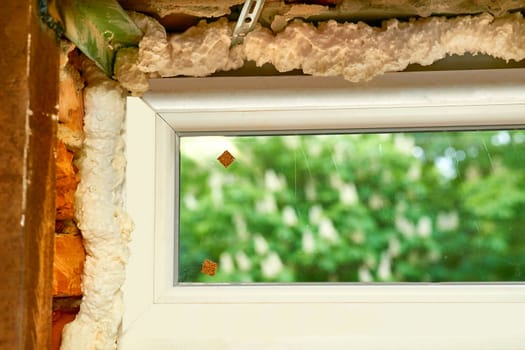 an opening in the wall or roof of a building that is fitted with glass