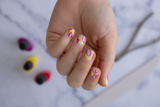 Stylish colorful summer female nails. Modern trendy stylish Beautiful manicure. Cute pastel nail minimalistic design concept of beauty treatment. Gel nails. Skin care. Beautician