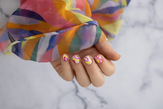 Stylish colorful summer female nails. Modern trendy stylish Beautiful manicure. Cute pastel nail minimalistic design concept of beauty treatment. Gel nails. Skin care. Beautician