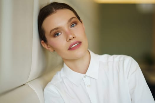 Portrait of a beauty young businesswoman leaning the head on a cafeteria