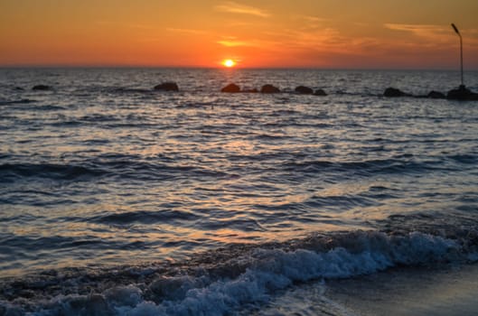 orange color of sunset on the Mediterranean coast on the island of Cyprus