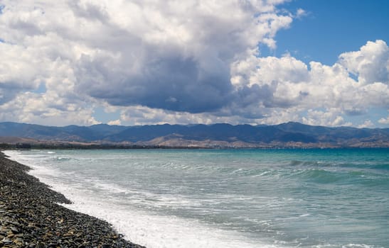 Mediterranean coast on the island of Cyprus on a sunny day, view of clouds and mountains 2