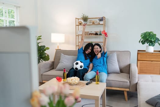 Happy football fan loudly congratulating team on winning tournament, match on tv.