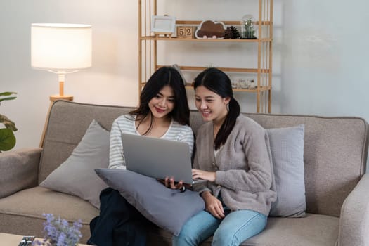 pride month Happy woman lesbian gay lgbt couple using laptop to video call with family, friends. LGBTQ couple concept.